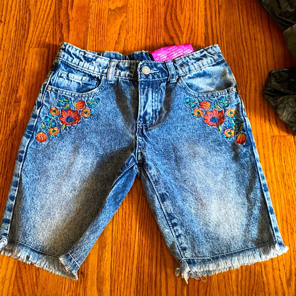 Long kid jean shorts , flower design , ages 9-10 , not worn
